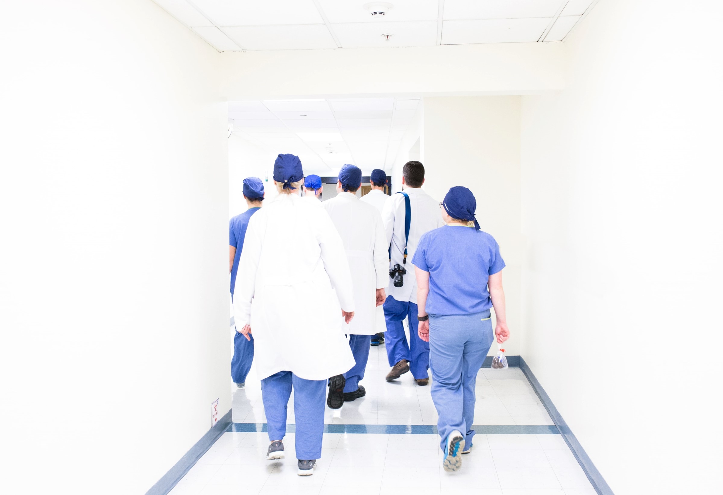 Frontline medical professionals walking to surgery 