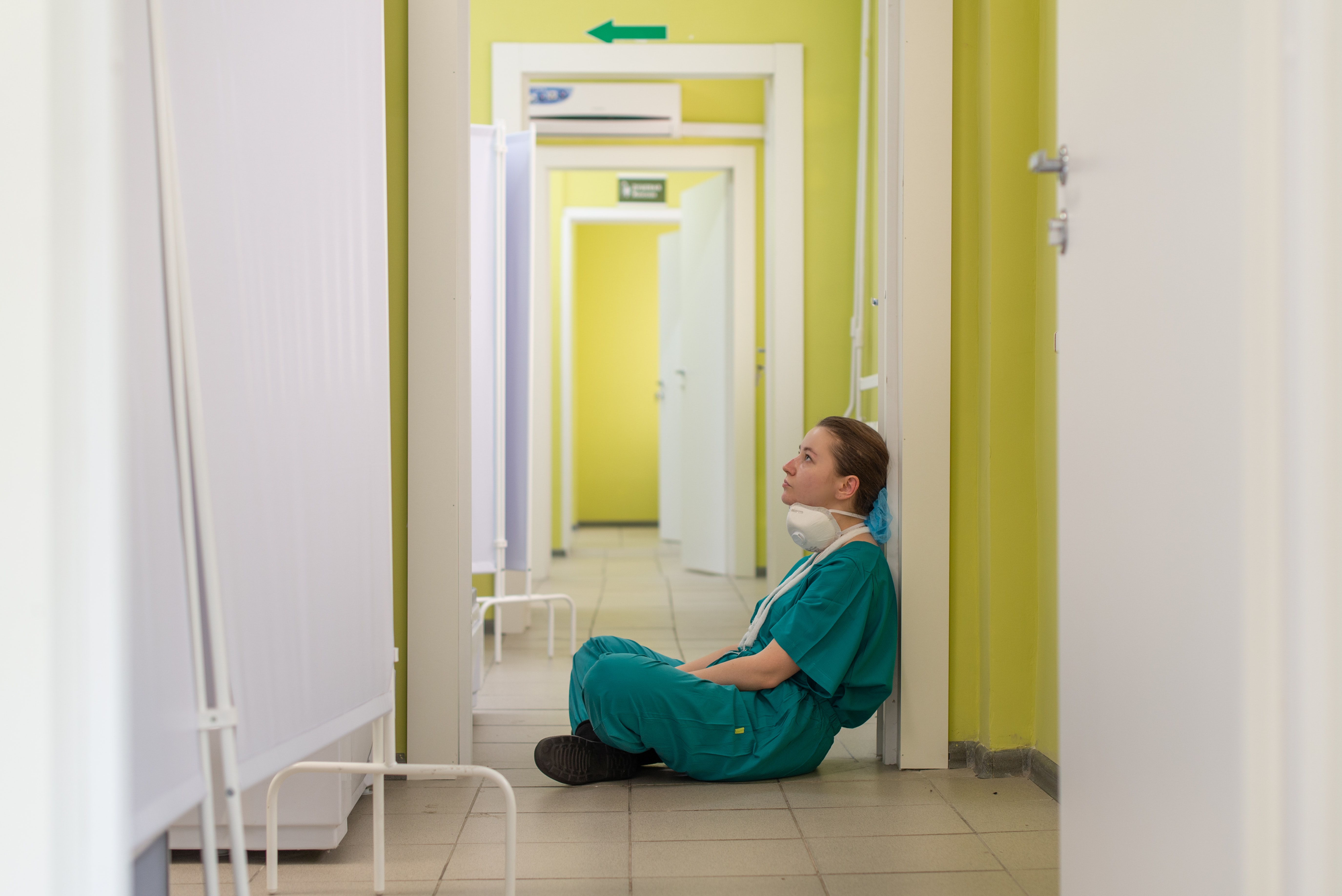 Medical professional sat in corridor 
