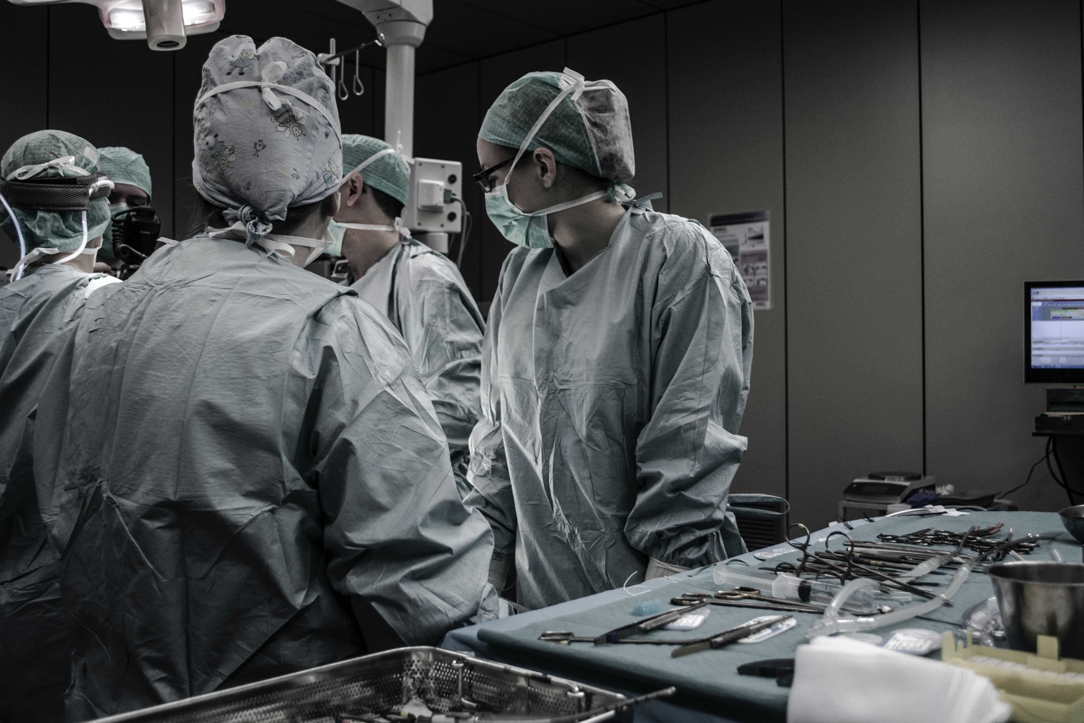 Medical professionals in surgical clothing